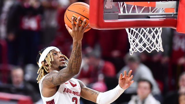 Razorbacks guard El Ellis with a layup against Texas A&M